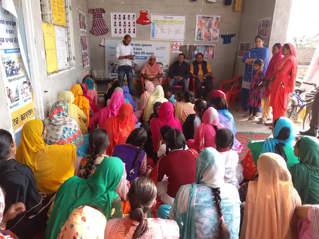 Women gathered at a community meeting
